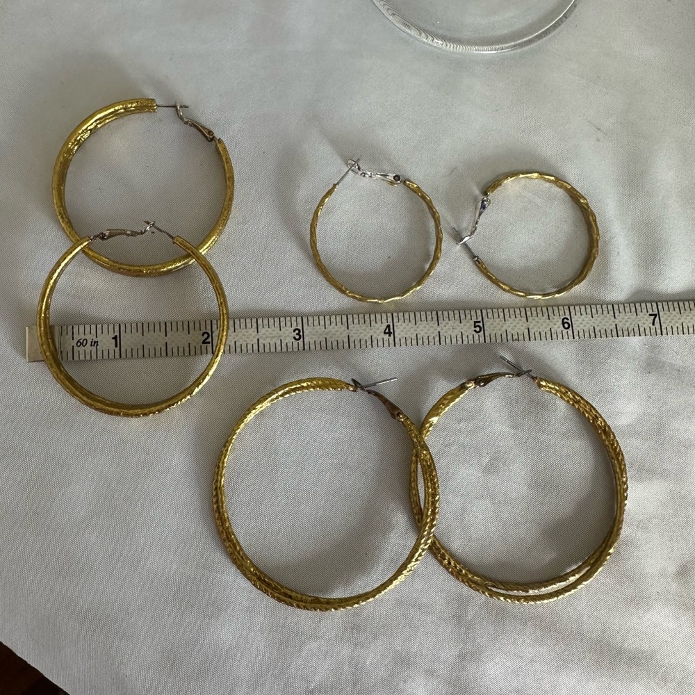 Three pair of goldtone hoops